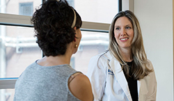 Dr. Andrea Abbott talks with patient Margie Bear
